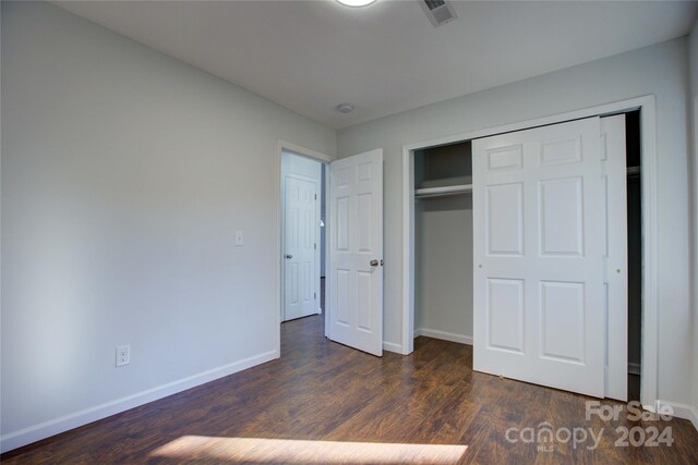 2515 Dion Ave, Charlotte, NC 28212 - unfurnished bedroom with dark wood-type flooring and a closet