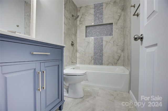 bathroom with tiled shower / bath combo and toilet