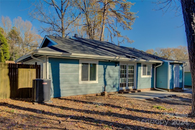 back of house with french doors and central AC