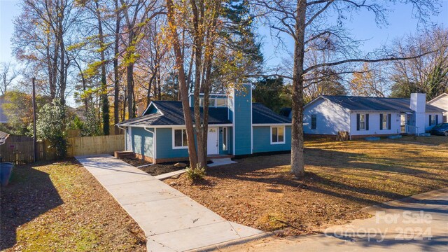 2515 Dion Ave, Charlotte, NC 28212 - view of front of home featuring concrete driveway and a chimney