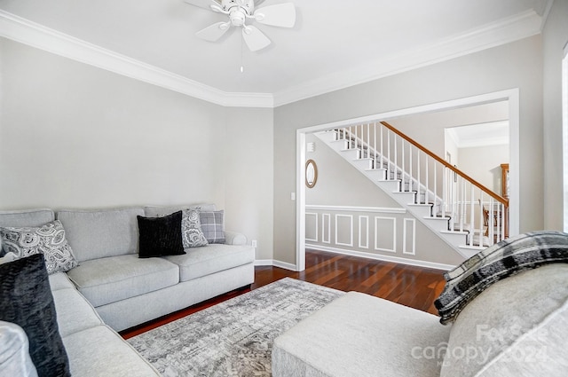 living room featuring ceiling fan, dark hardwood / wood-style flooring, and ornamental molding