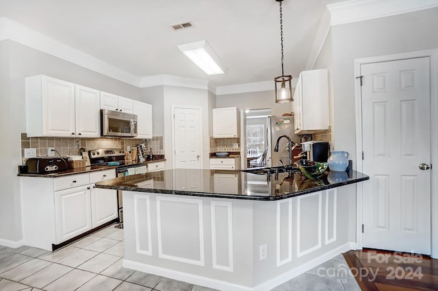 kitchen with kitchen peninsula, white cabinetry, hanging light fixtures, and appliances with stainless steel finishes