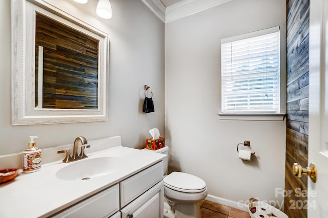 bathroom featuring toilet, vanity, tile patterned floors, and crown molding