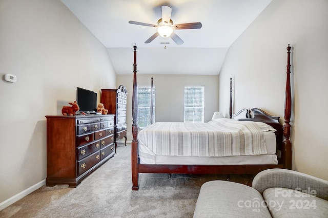 bedroom featuring ceiling fan, carpet, and lofted ceiling