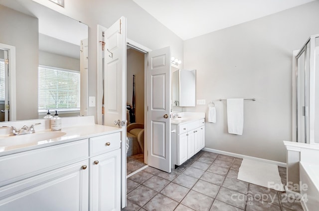 bathroom with tile patterned floors and vanity