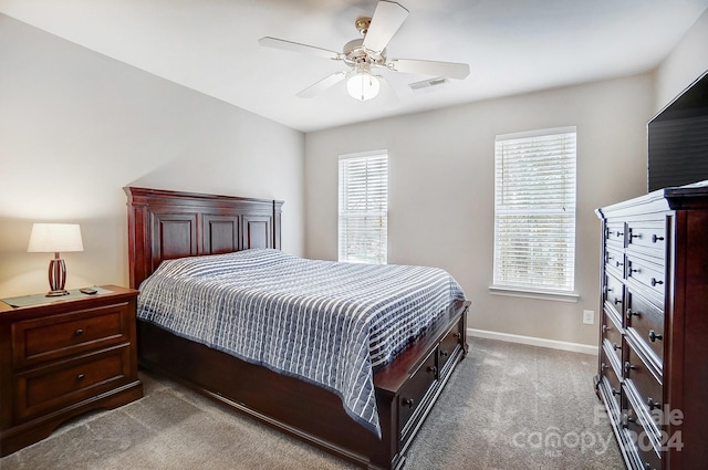 bedroom with ceiling fan and carpet floors