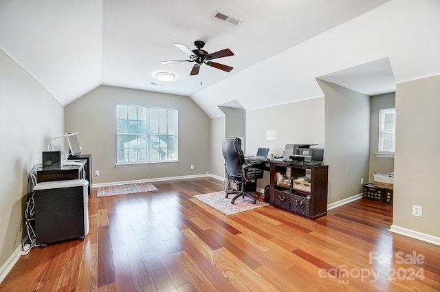 office space featuring ceiling fan, wood-type flooring, and vaulted ceiling