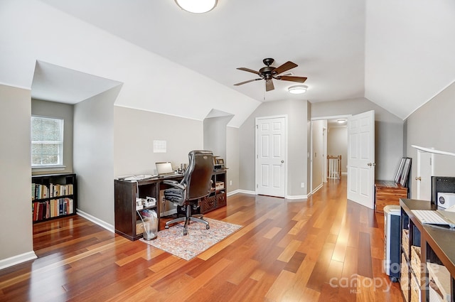 office space with dark hardwood / wood-style floors, ceiling fan, and lofted ceiling