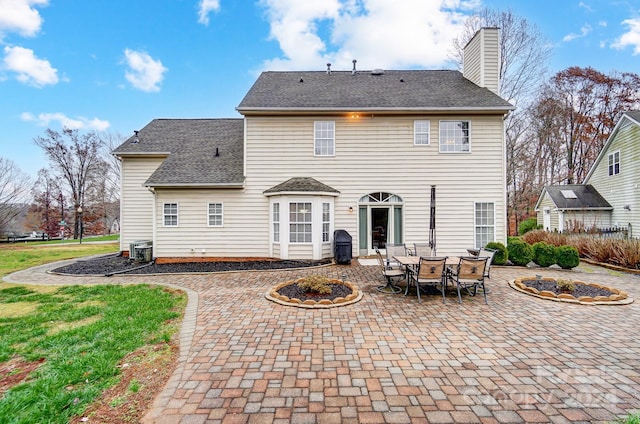 back of property featuring a patio area and central AC unit