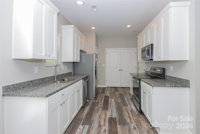 kitchen featuring white cabinetry, sink, and appliances with stainless steel finishes