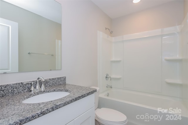 full bathroom featuring shower / bathing tub combination, vanity, and toilet