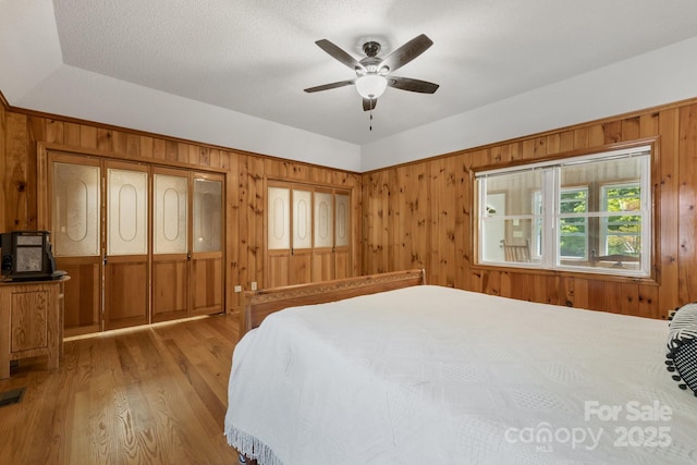 bedroom with ceiling fan and light wood-type flooring