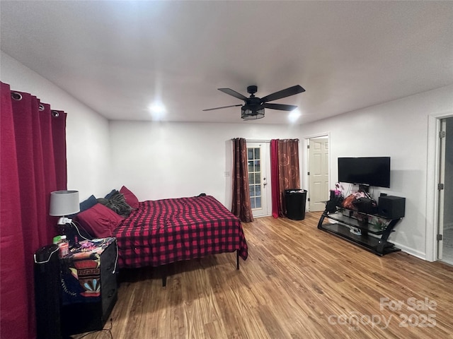 bedroom with ceiling fan and wood-type flooring