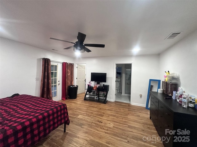 bedroom featuring hardwood / wood-style flooring and ceiling fan