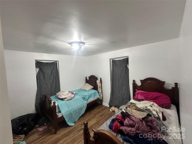 bedroom featuring dark wood-type flooring