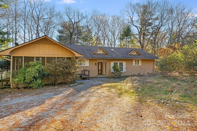 ranch-style home featuring a sunroom