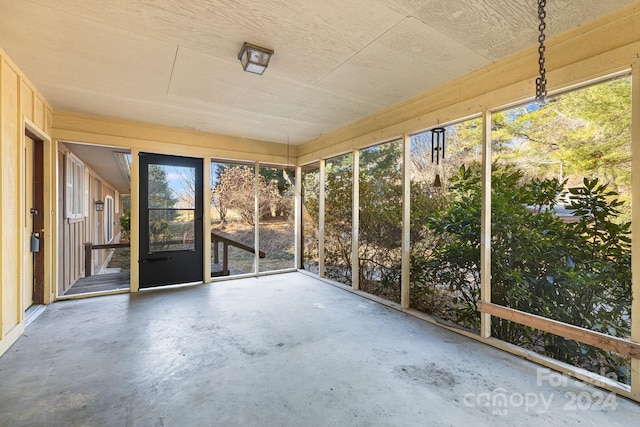 unfurnished sunroom featuring a wealth of natural light