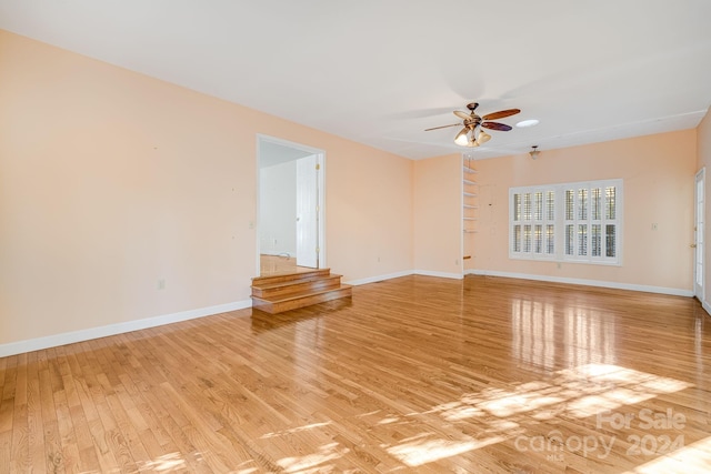 spare room featuring ceiling fan and light hardwood / wood-style floors