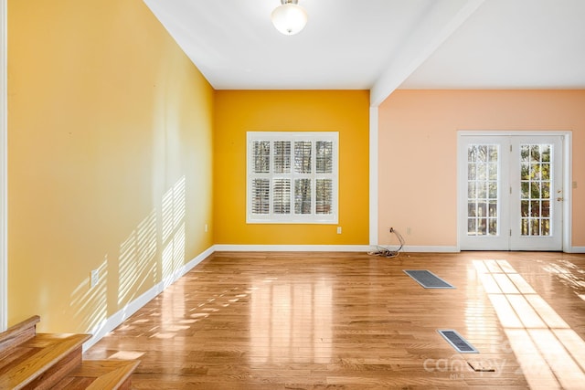 empty room featuring hardwood / wood-style flooring