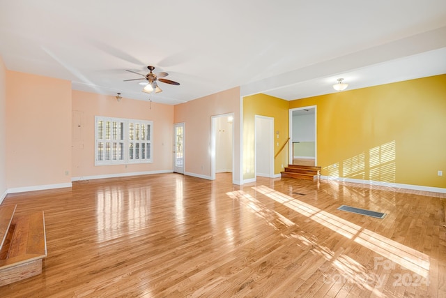 spare room with ceiling fan and light hardwood / wood-style flooring