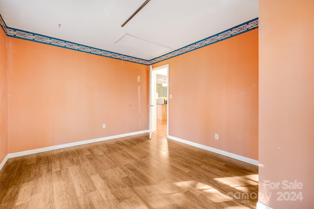 spare room featuring light hardwood / wood-style flooring