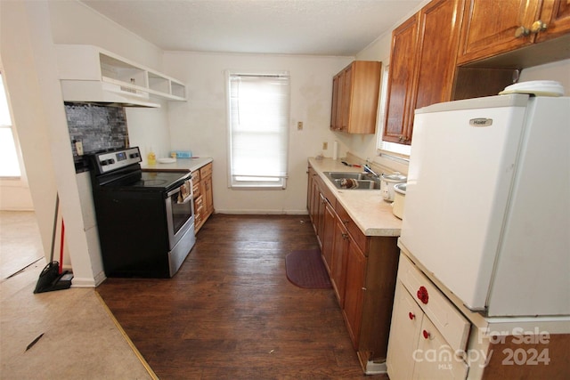 kitchen featuring electric stove, sink, dark hardwood / wood-style floors, and white refrigerator