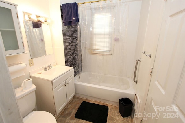 full bathroom featuring shower / bath combo, vanity, and toilet