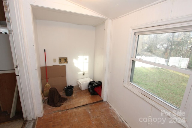 laundry room featuring washer hookup and parquet flooring