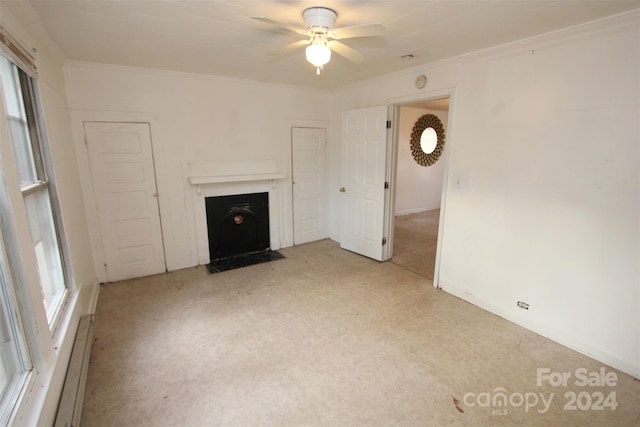 unfurnished living room featuring ceiling fan, crown molding, light carpet, and a baseboard radiator