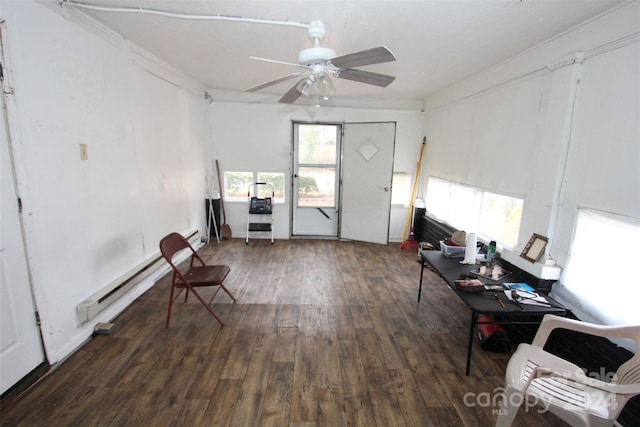 sitting room with ceiling fan, dark wood-type flooring, and a baseboard heating unit