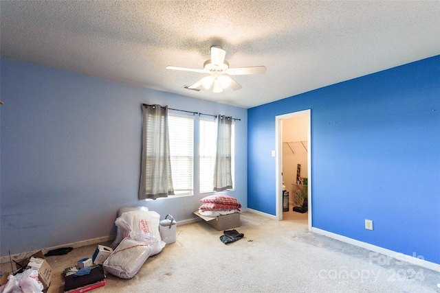 interior space with a textured ceiling, a closet, a spacious closet, and ceiling fan