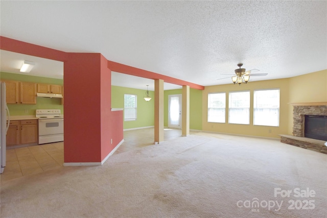 1114 Fenwick Ct, Clover, SC 29710 - unfurnished living room with ceiling fan, a fireplace, baseboards, light carpet, and light tile patterned flooring