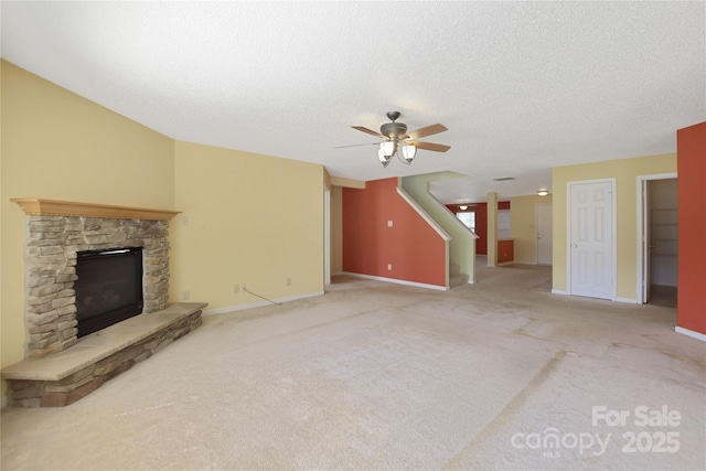 1114 Fenwick Ct, Clover, SC 29710 - unfurnished living room with a ceiling fan, baseboards, carpet, and a fireplace
