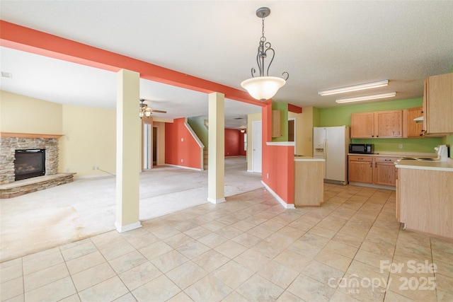1114 Fenwick Ct, Clover, SC 29710 - kitchen featuring light colored carpet, black microwave, light countertops, white fridge with ice dispenser, and open floor plan