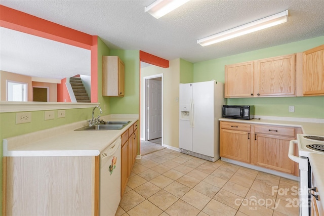1114 Fenwick Ct, Clover, SC 29710 - kitchen featuring light brown cabinets, white appliances, light countertops, a textured ceiling, and a sink