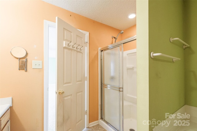 1114 Fenwick Ct, Clover, SC 29710 - full bath featuring vanity, a shower stall, and a textured ceiling