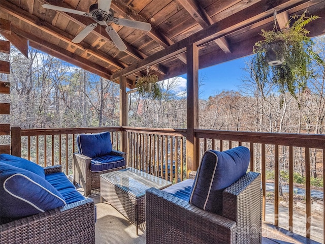 wooden deck featuring ceiling fan