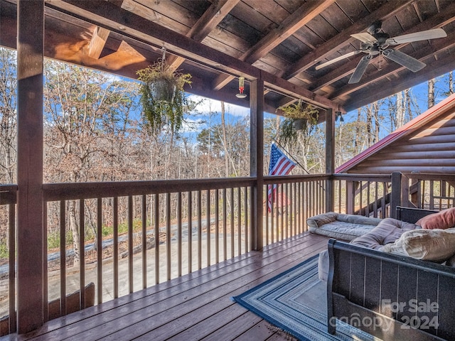 wooden deck featuring ceiling fan