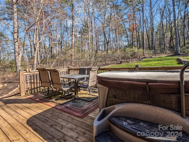 deck featuring a hot tub