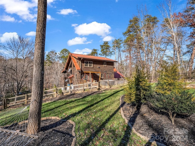 back of property with a lawn