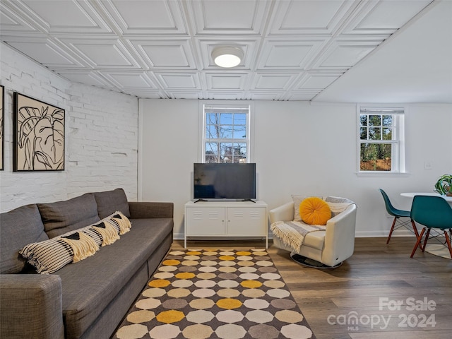 living room featuring hardwood / wood-style flooring and a healthy amount of sunlight