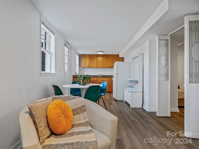 dining area featuring hardwood / wood-style floors and sink