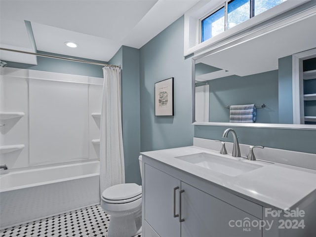 full bathroom featuring tile patterned floors, vanity, shower / tub combo, and toilet