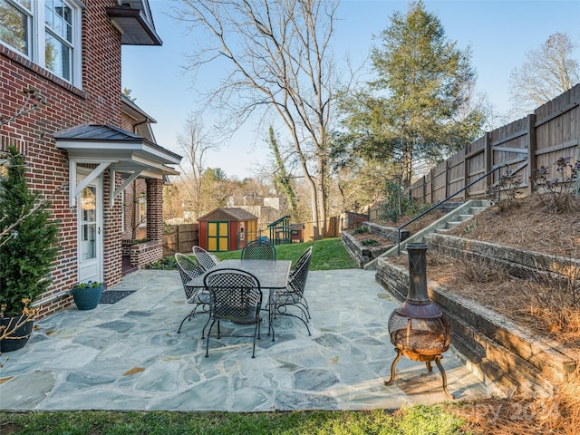 view of patio / terrace with a storage shed