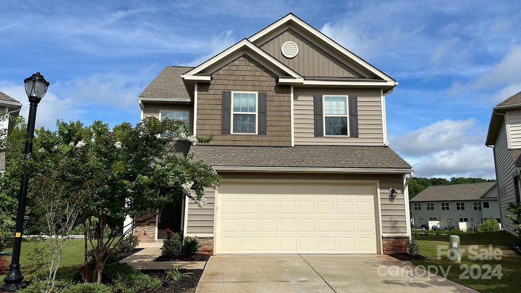 craftsman inspired home featuring a garage