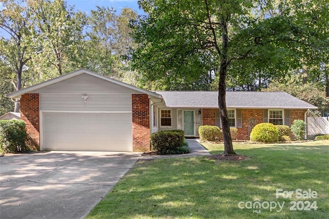 single story home featuring a front yard and a garage