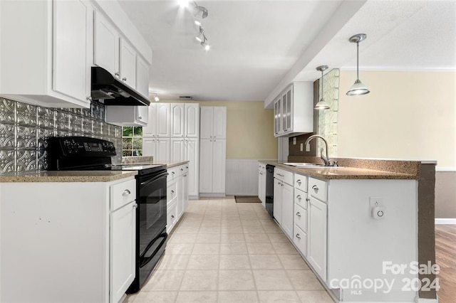 kitchen with white cabinetry, pendant lighting, black appliances, and sink