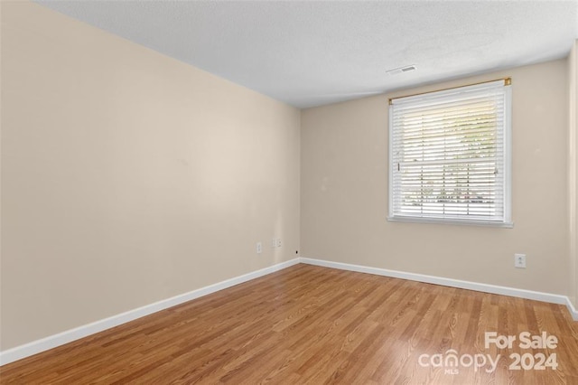 empty room with light hardwood / wood-style floors