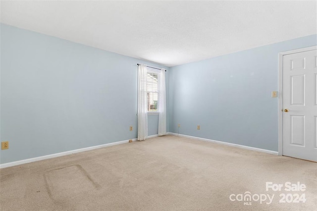 empty room with light carpet