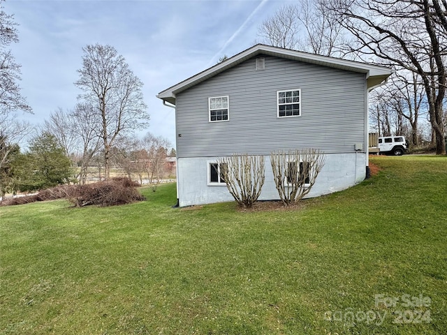 view of property exterior featuring a yard